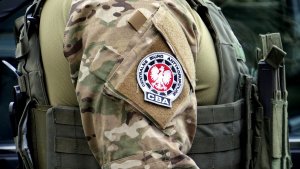 Close-up of the shoulder of a CBA officer in uniform