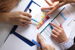 Documents on the table, with charts