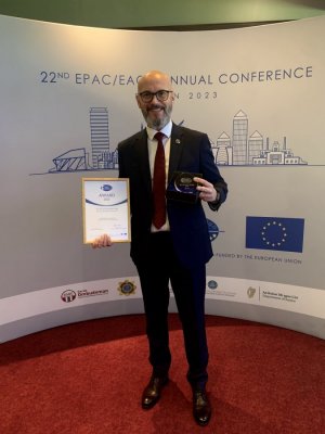 a person standing on the conference wall