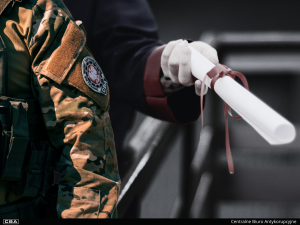 CBA uniform and a rolled up document