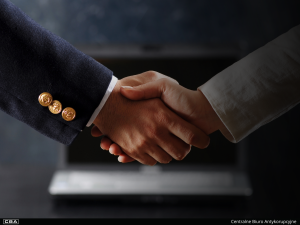 close-up of people shaking hands