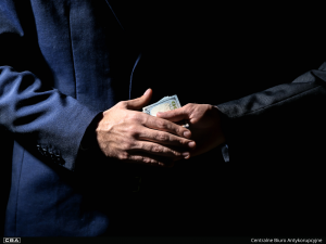 two people passing money to each other